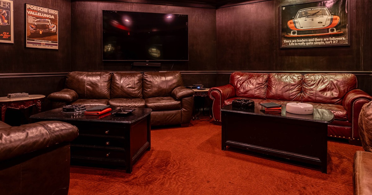 Interior, lounge seating area, three seater sofas with apothecary style tables