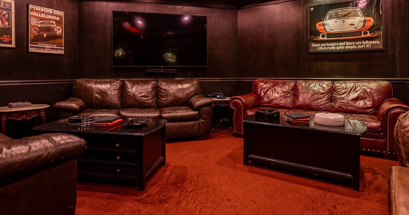 Interior, lounge seating area, three seater sofas with apothecary style tables