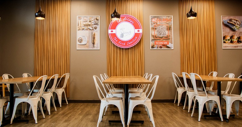 Interior, tables and chairs near wall