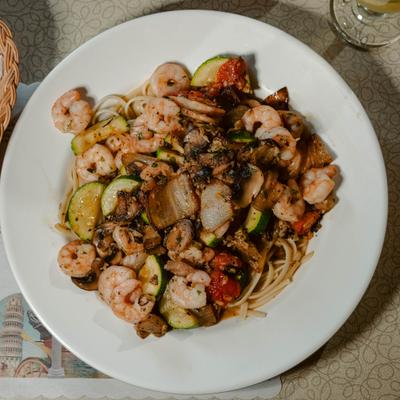 Shrimp and spaghetti pasta tossed with sliced zucchini, tomatoes, and herbs.
