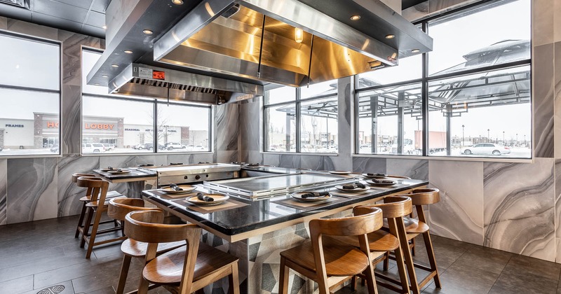 Interior, Teppanyaki grill table with high seating stools, large windows