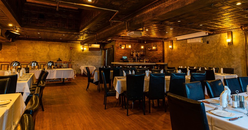 Interior, upstairs dining area, tables with chairs, ready for guests, serving station in the corner
