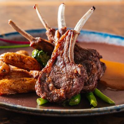 Grilled Lamb Chops served with roasted potatoes and broccoli rabe.