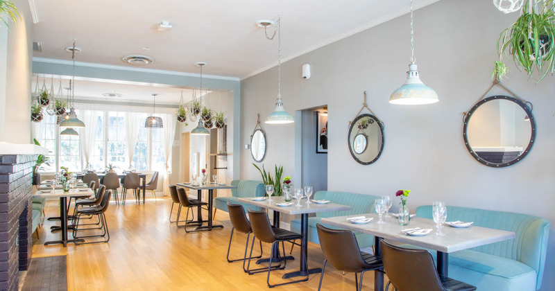 Upstairs interior with  tables and seats ready for guests