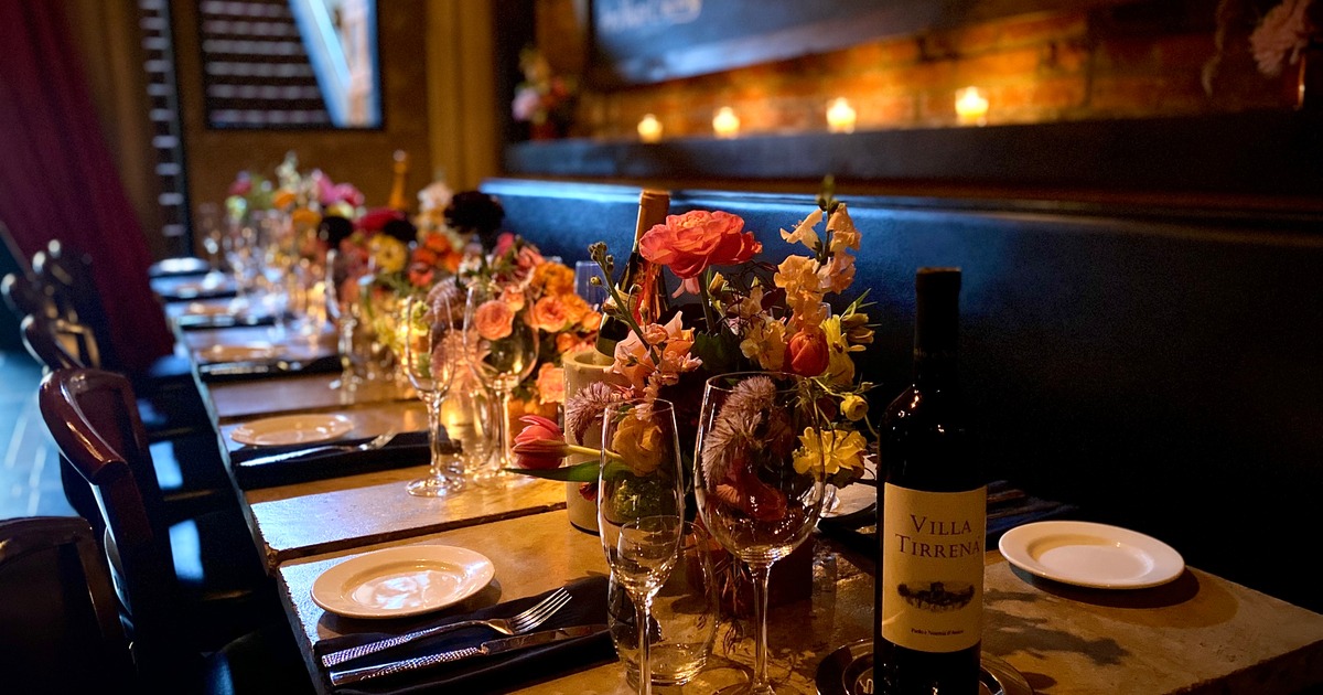 Fully set tables with floral centerpieces