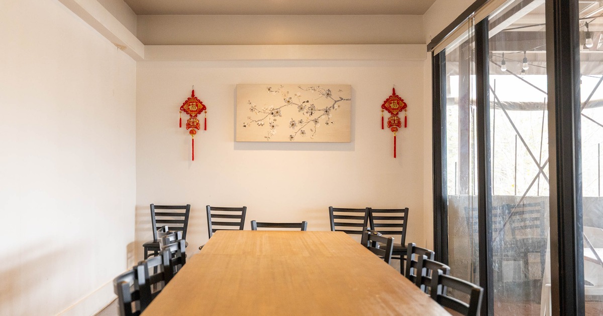 Interior of a room with a long wooden table