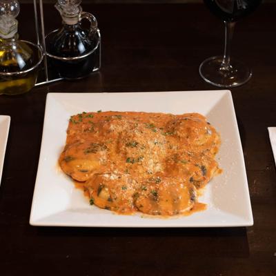 Ravioli covered in sauce.