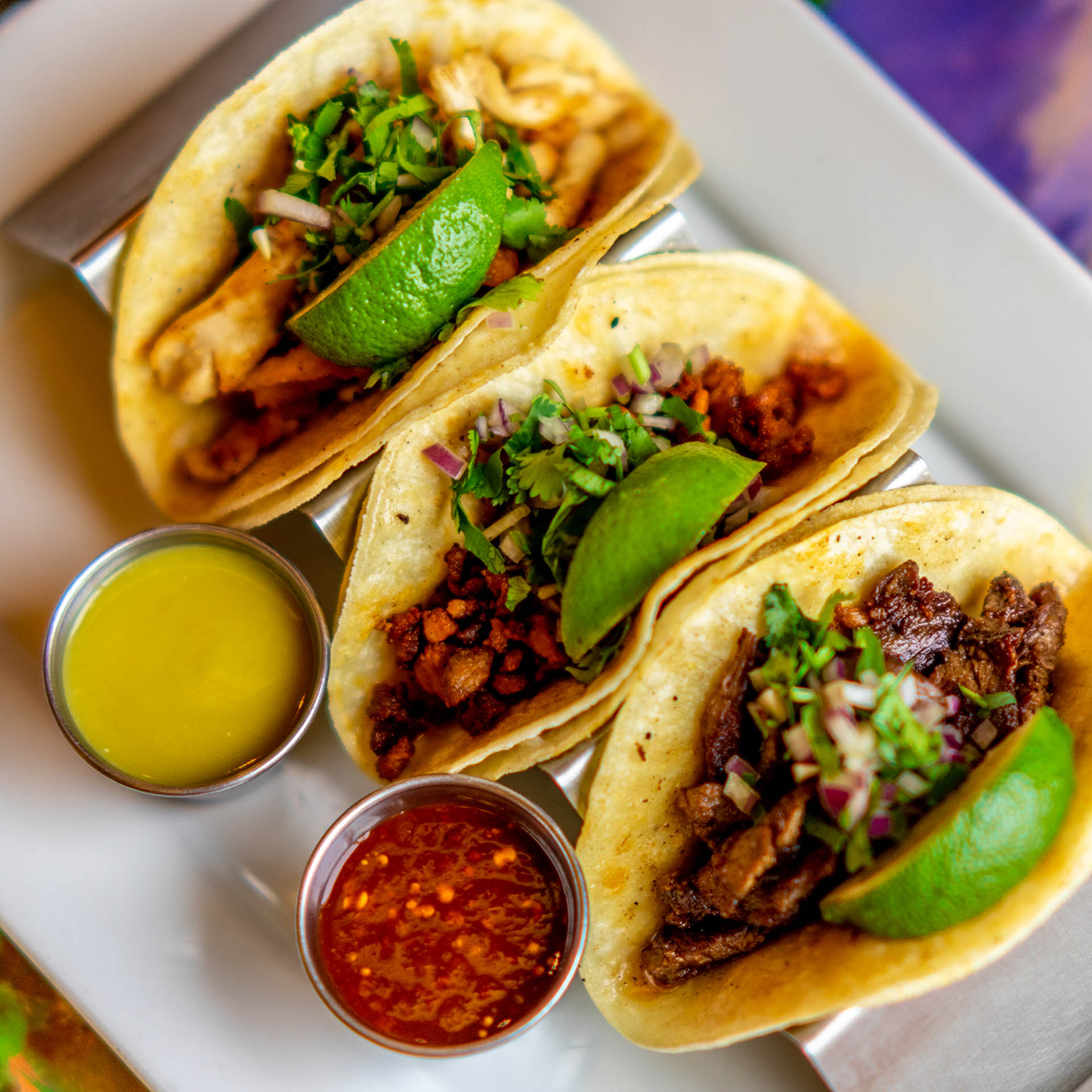 Tacos served with dip
