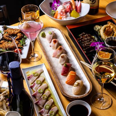 Assorted Japanese dishes and drinks on a table.