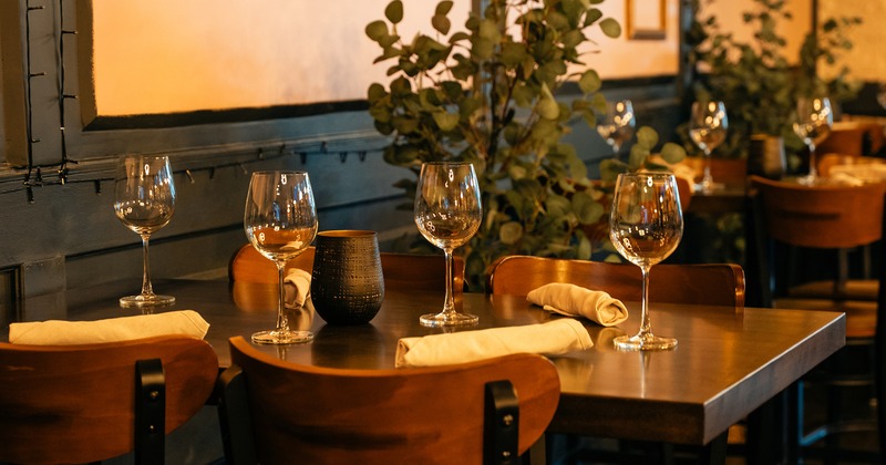 Dining table set for four guests, close up