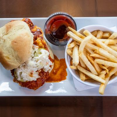 Crispy Chicken Sandwich tipped with coleslaw, served with fries and a dipping sauce.