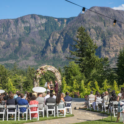 Bride and groom with natural landscape in the back