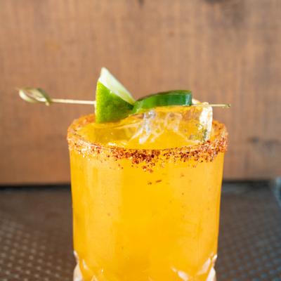 A served margarita with lime.