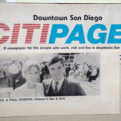 A newspaper clipping with a photo of Carol and Paul Dobson