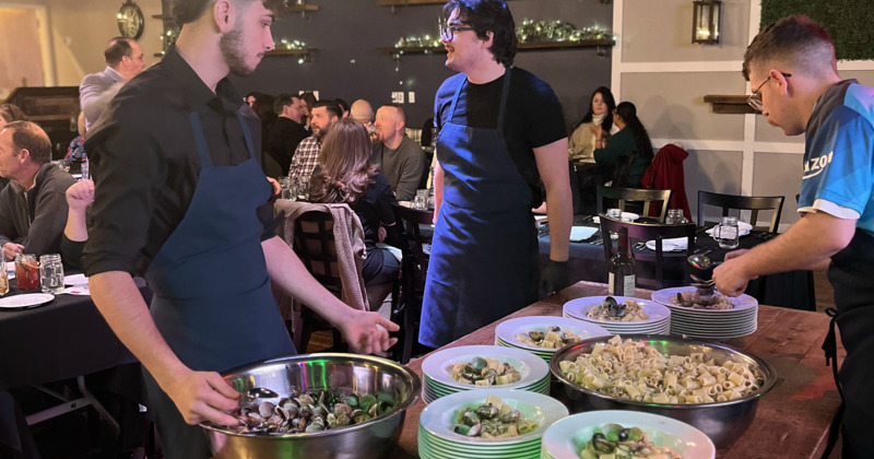 Interior, serving pasta  on plates