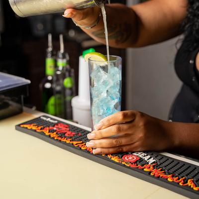 Person pouring drink in the glass.