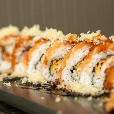 Spicy tuna, shrimp tempura, tempura flakes, and salmon sushi rolls.