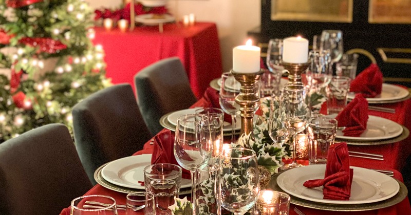 Interior, table with glasses, napkins, tableware and silverware, prepared for an event