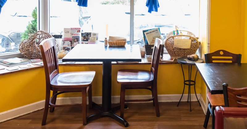 Table and chairs next to the window