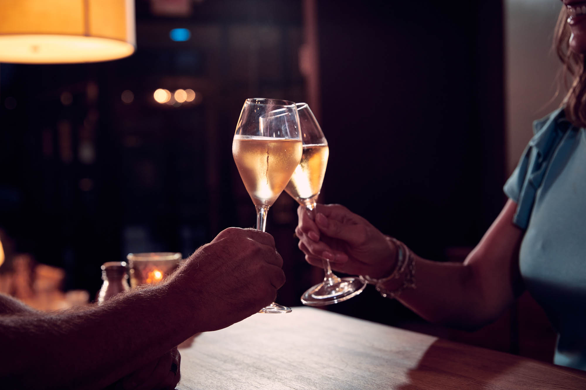 Hands toasting with their glasses