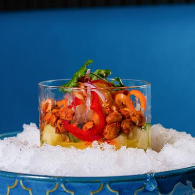 Jicama and pineapple with spicy peanuts and red peppers served over crushed ice.