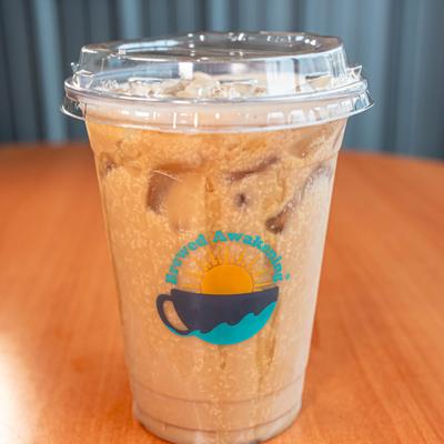 Iced coffee drink in clear plastic cup.