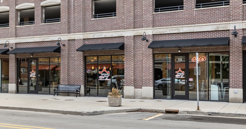 Exterior, front view to restaurant part of parking lot in front