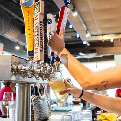 Bartender sipping beer.