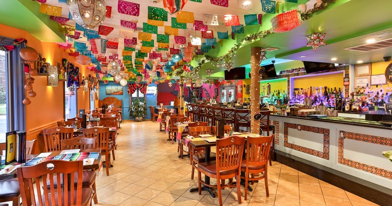Interior, wide view, tables with tableware and chairs