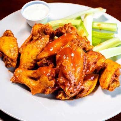 Buffalo wings, with celery and ranch dressing.
