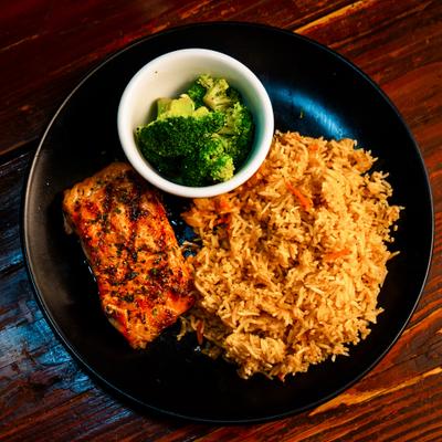 Grilled salmon with Spanish rice and steamed broccoli.