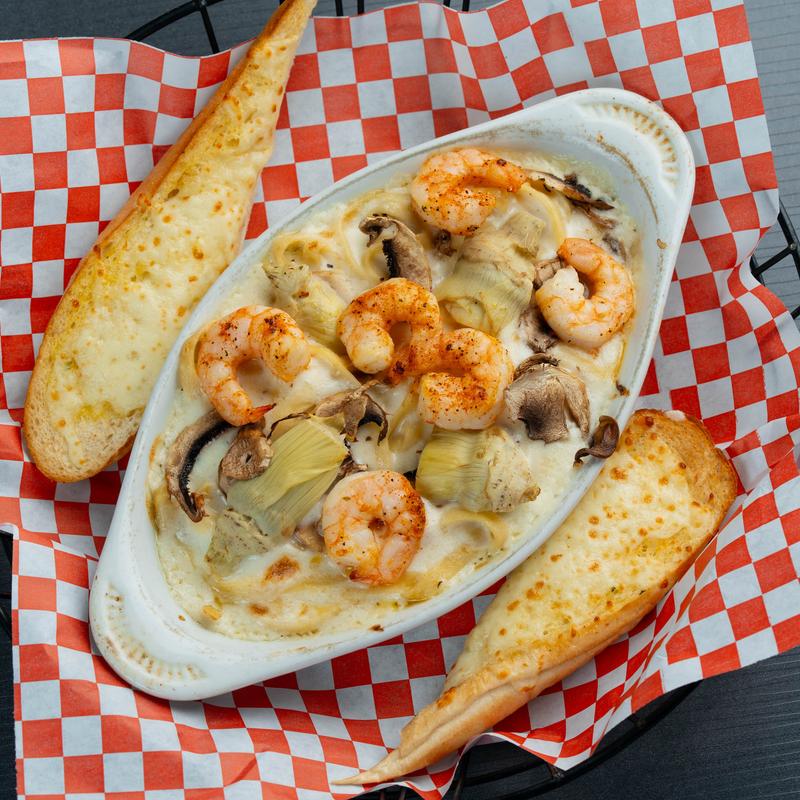 Shrimp Alfredo with mushrooms and artichoke.