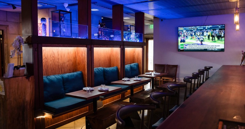 Interior, tables ready for guests, TV on the wall