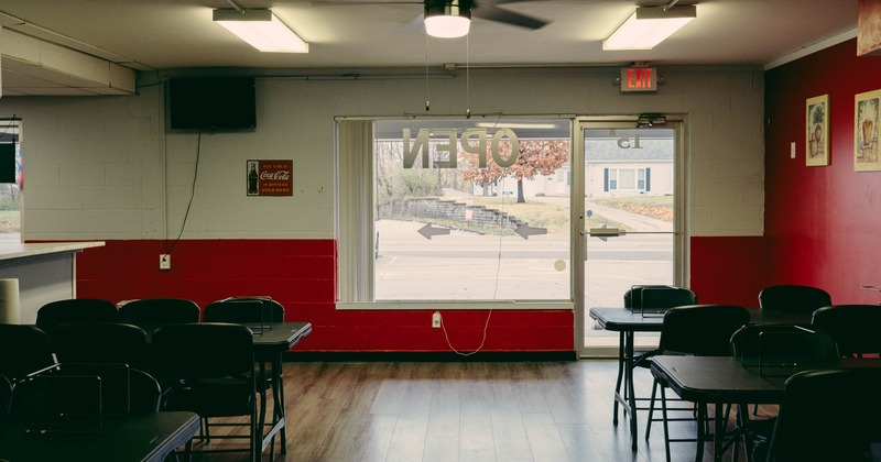 Interior, dining area, tables with chairs, entrance, large shop window