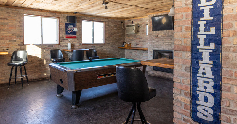 Interior, a pool table, wall-mounted table with chairs, a wall TV