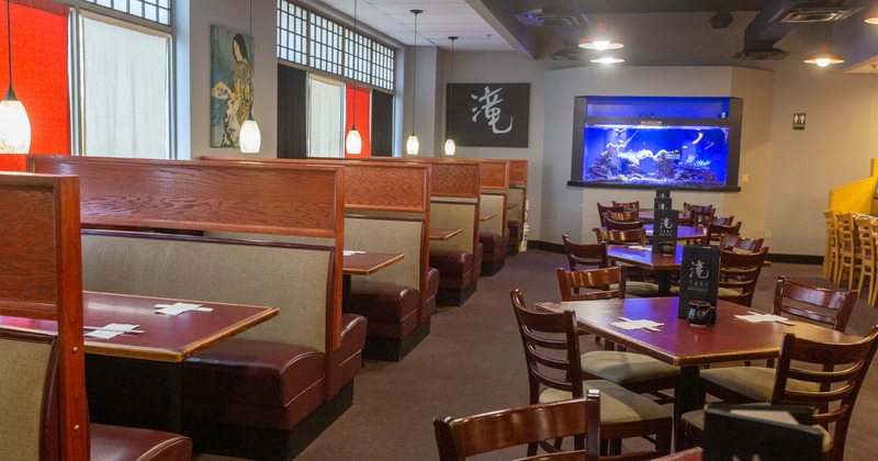 Interior, high back booths on the left side and tables for four on the right
