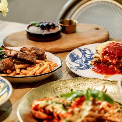 Assorted food plates on a table.
