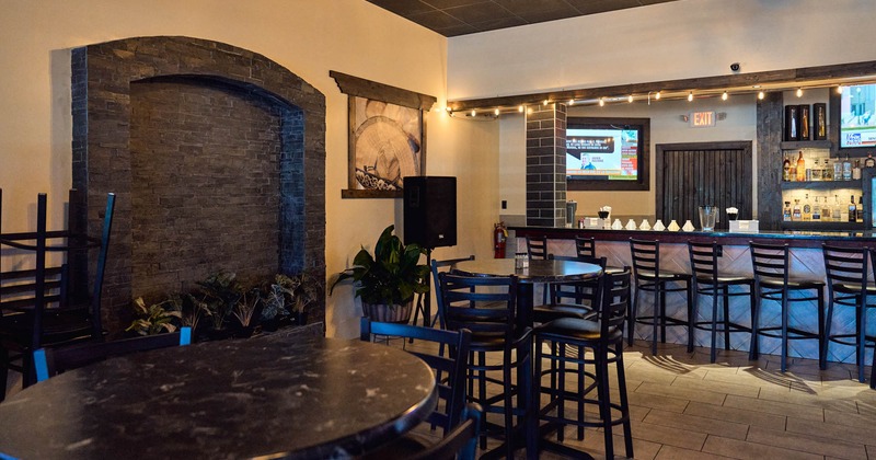 Interior, seating area with a bar in the back