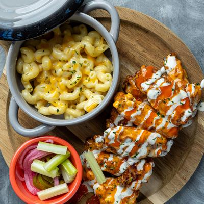Buffalo Chicken Mac and Cheese meal with a side of celery sticks.
