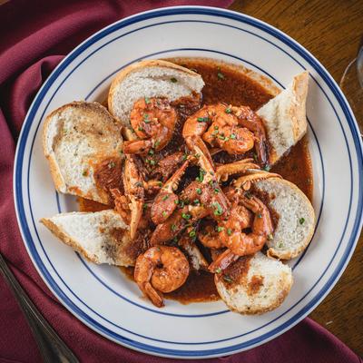 Shrimp and crab in BBQ sauce, with bread.