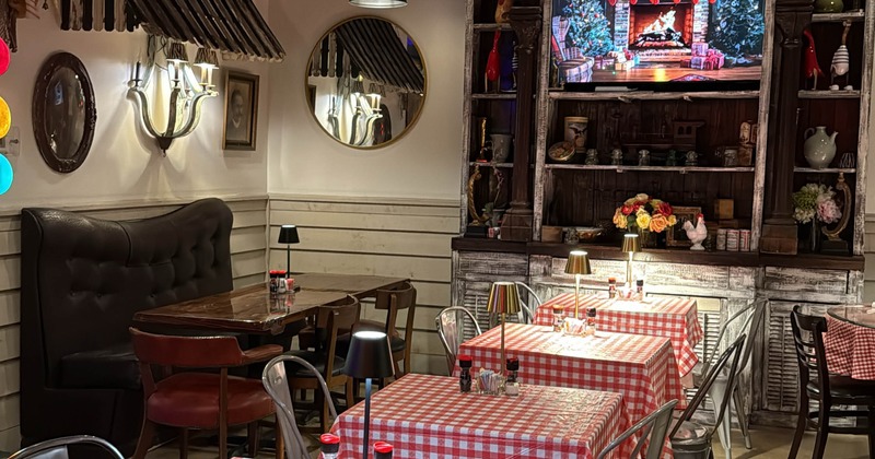 Interior with decorations and tables with red-and-white checkered tablecloths