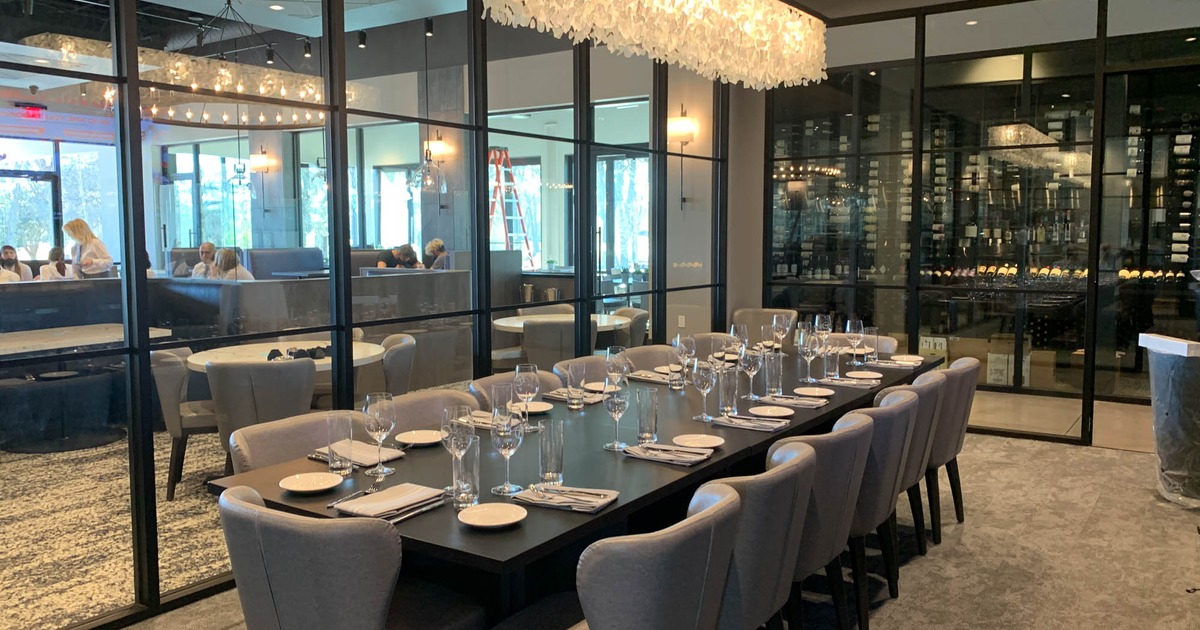 Interior, a long table ready for guests