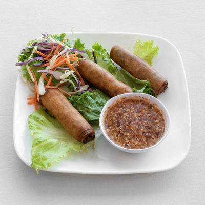 Crispy egg rolls with sweet chili sauce.