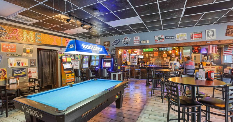 Interior, seating area with a pool table in the middle