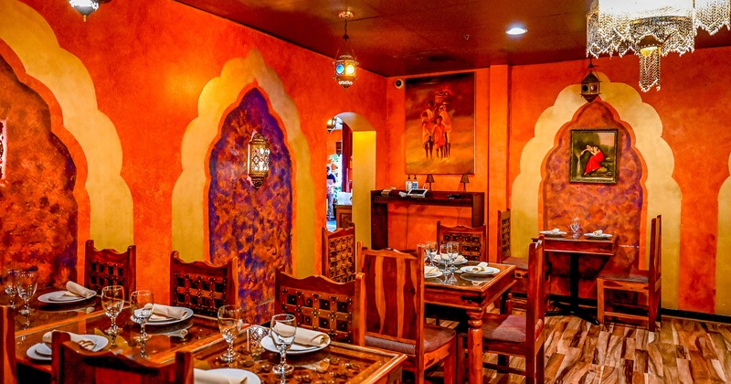 Indian-style design of the dining area with set tables