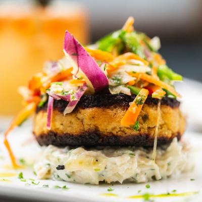 Crab croquette with celery remoulade & micro greens.