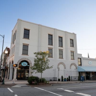 Restaurant's building featuring three-story exterior with arched ground-floor windows.