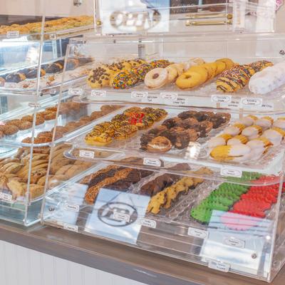 Assorted cookies and pastries in a glass bakery display.