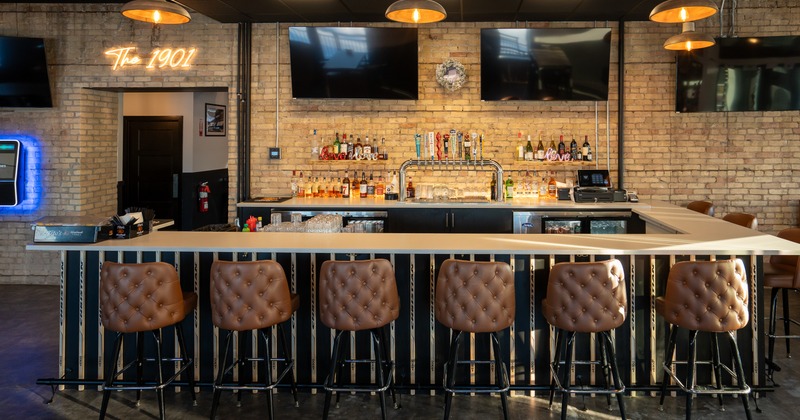 Front view to bar, stools, drink rack