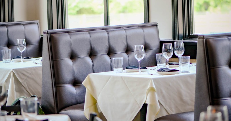 Interior, tables set for guests,  dining area